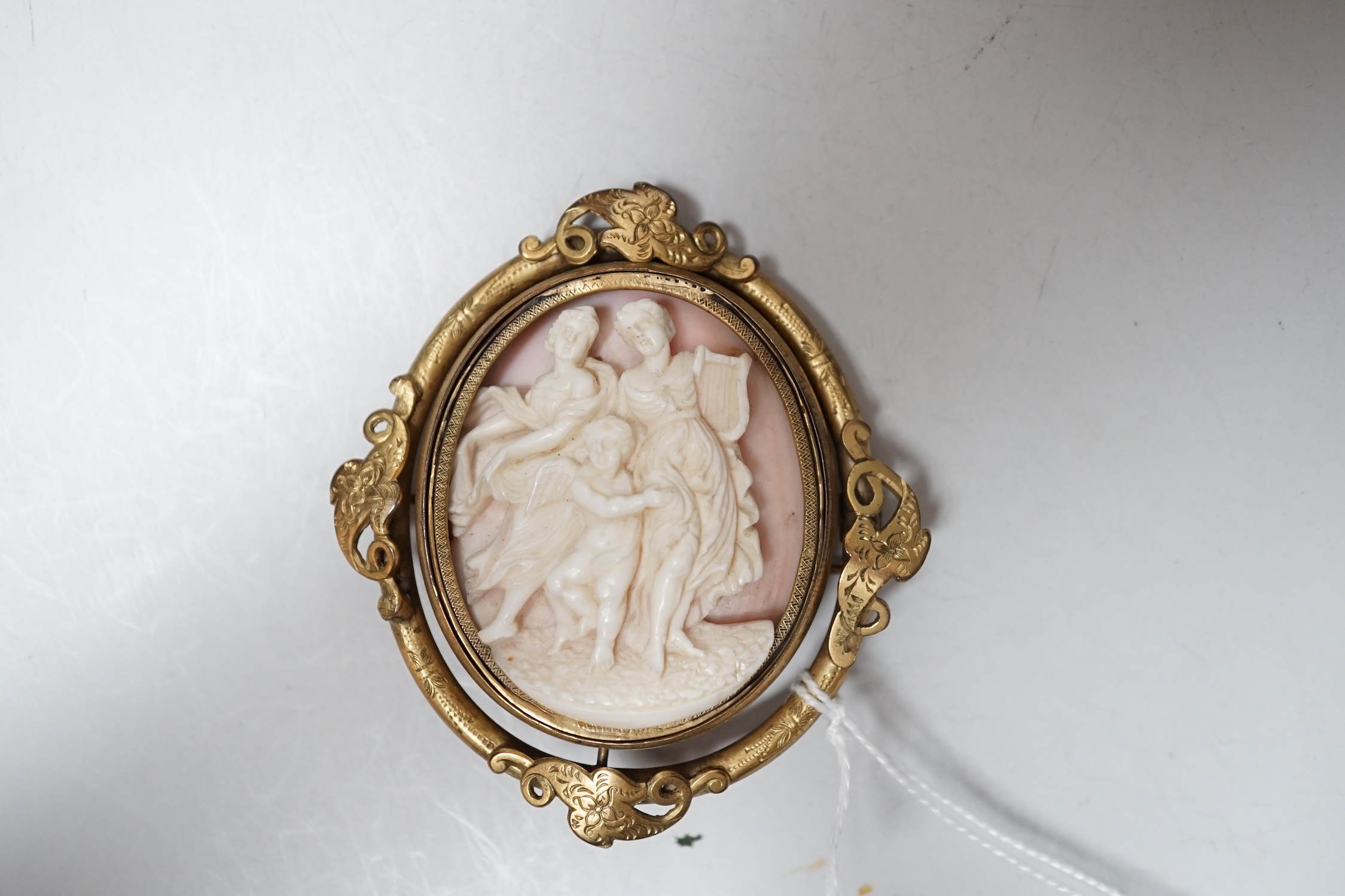 A crocodile jewellery box and a cameo brooch.
